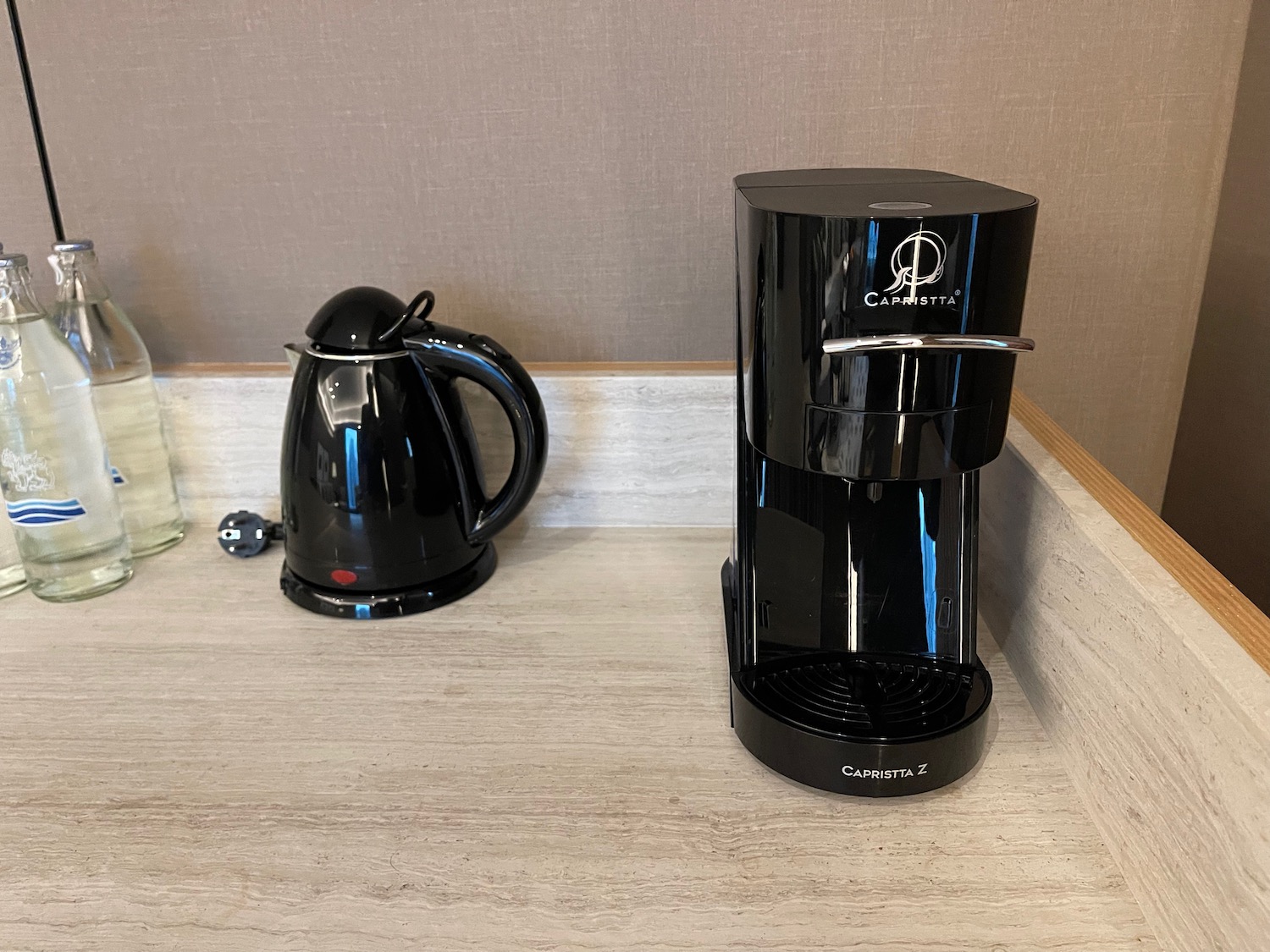 a coffee maker and a kettle on a counter