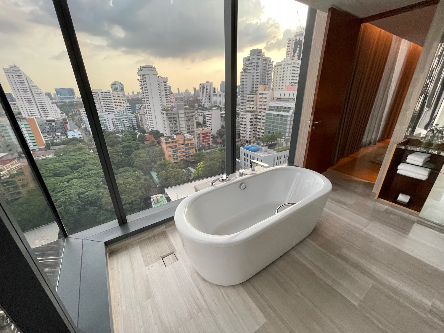 a bathtub in a room with large windows