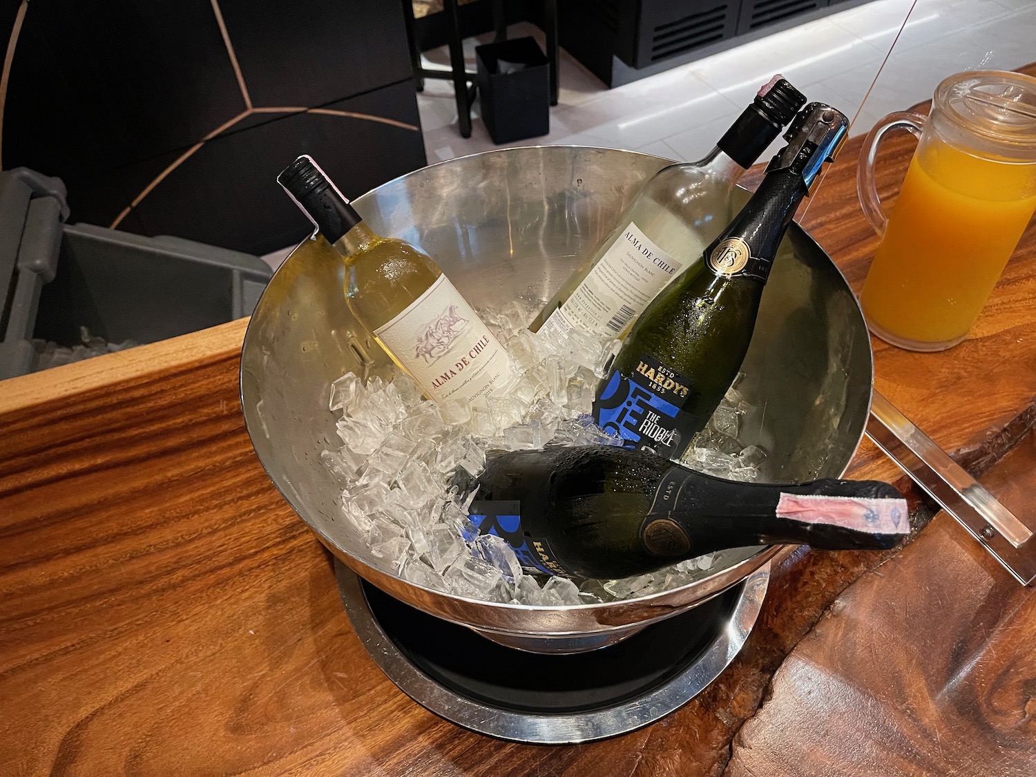 a group of bottles in a bowl of ice