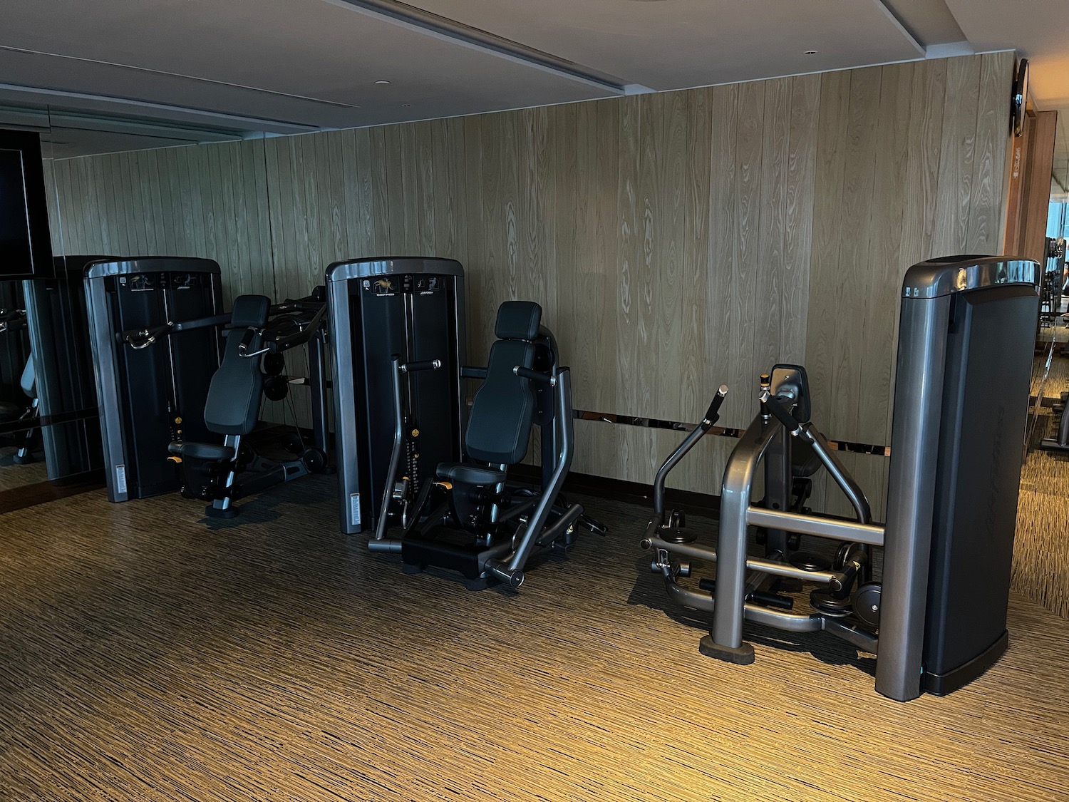 a group of exercise equipment in a room