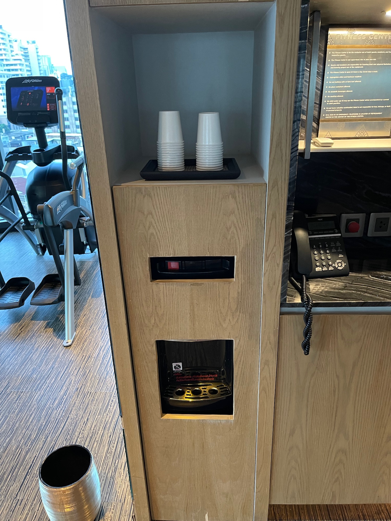 a machine with cups on a shelf