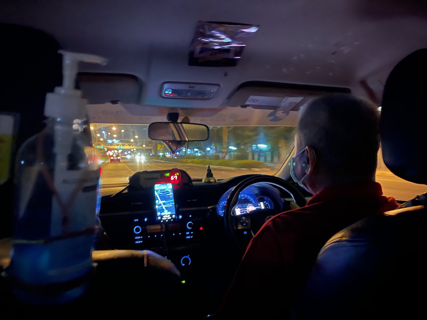 a man driving a car at night