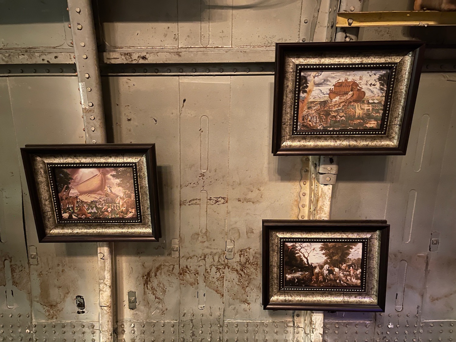 a group of framed pictures on a wall