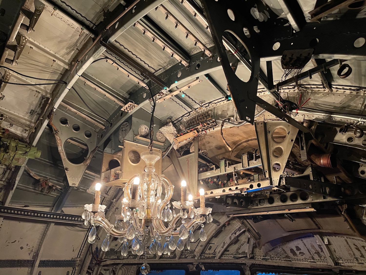 a chandelier from the ceiling of a plane