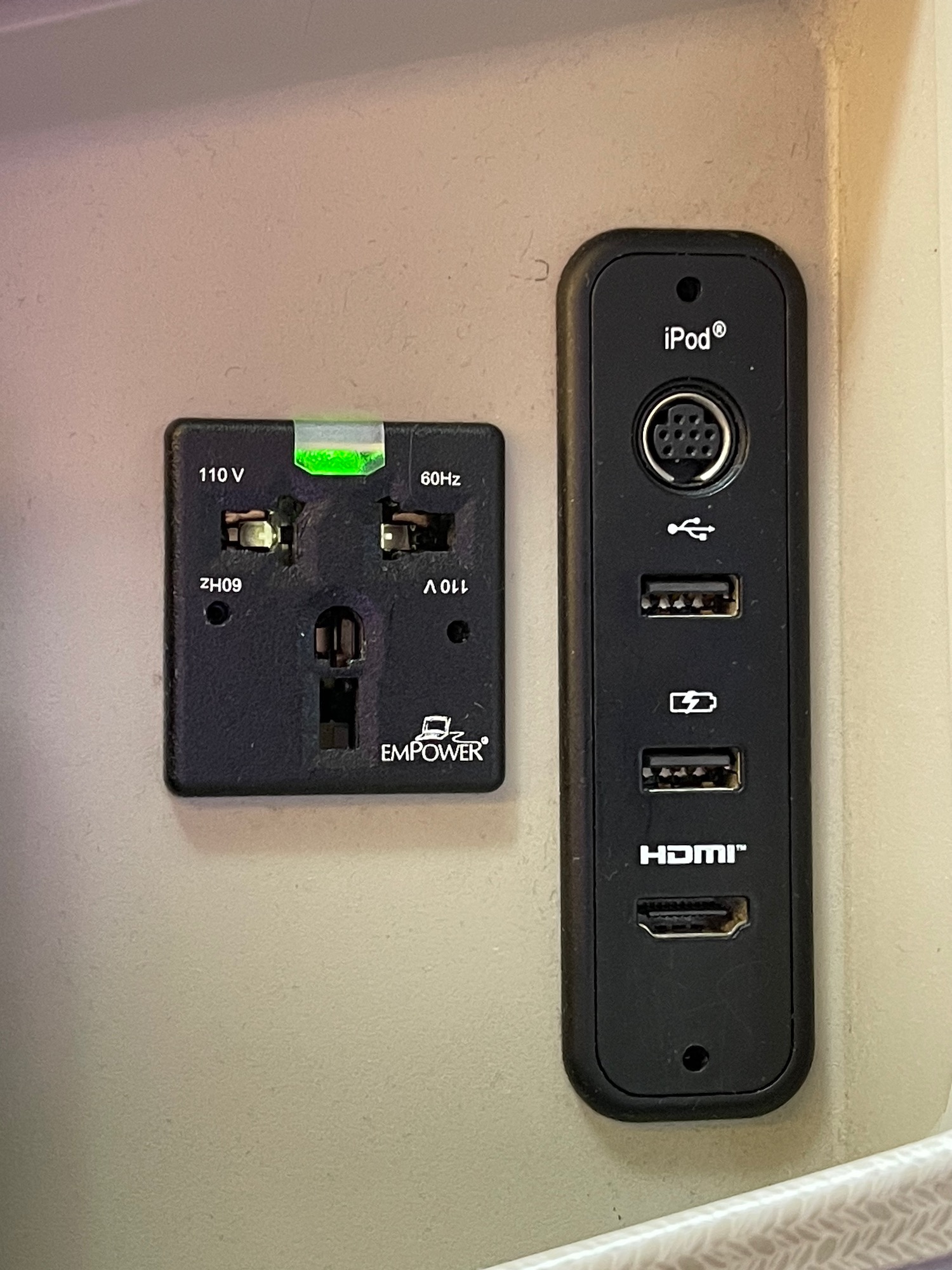 a black outlet with a black panel and a black plug in
