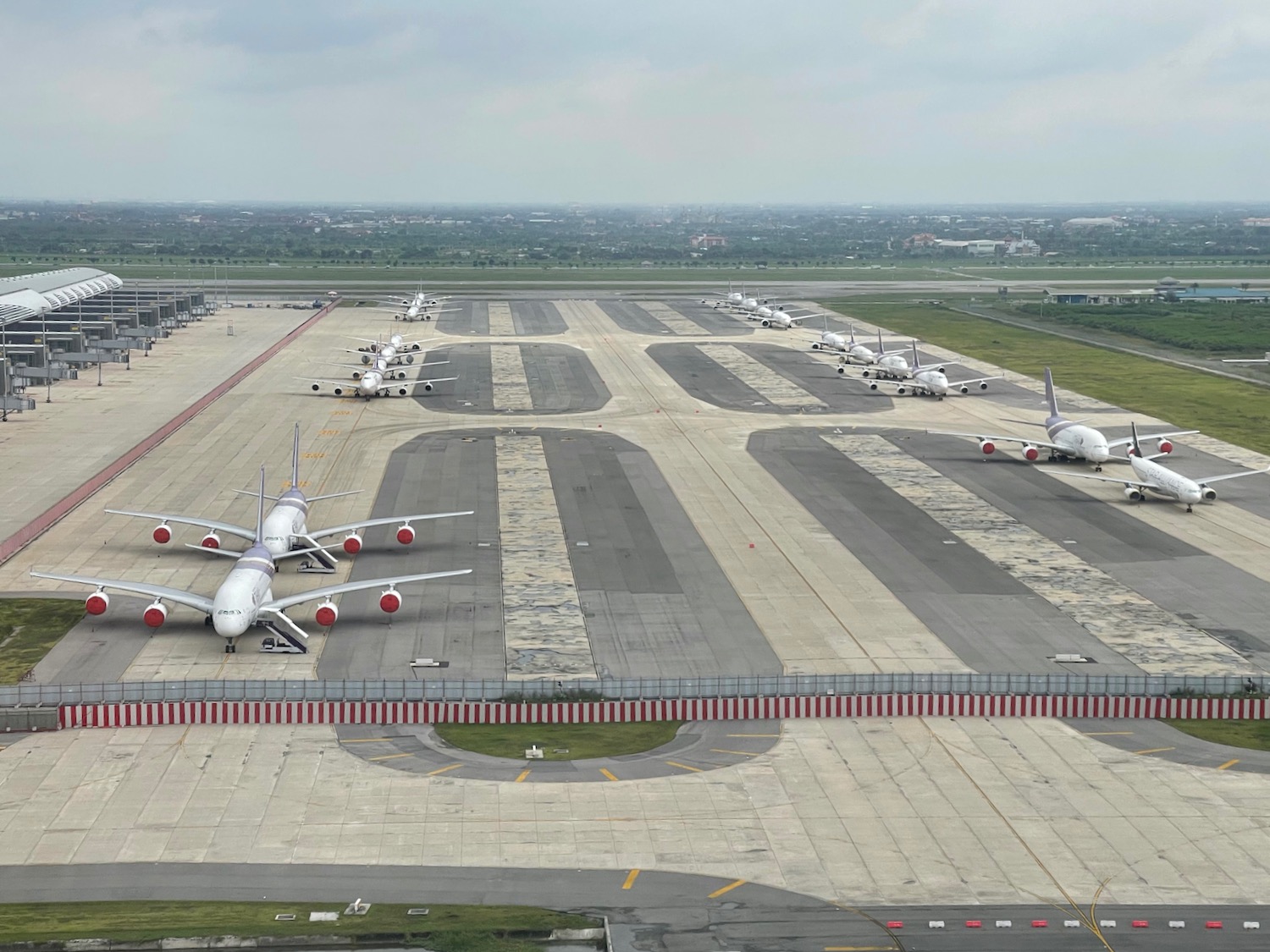 a group of airplanes on a runway