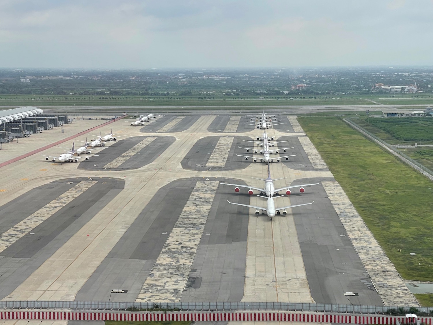 a group of airplanes on a runway