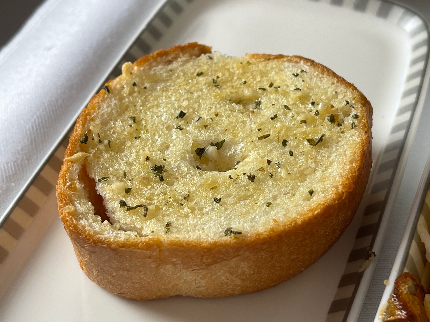 a slice of garlic bread on a plate