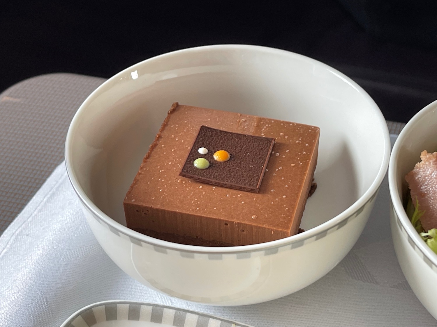 a brown square with a white square in a white bowl