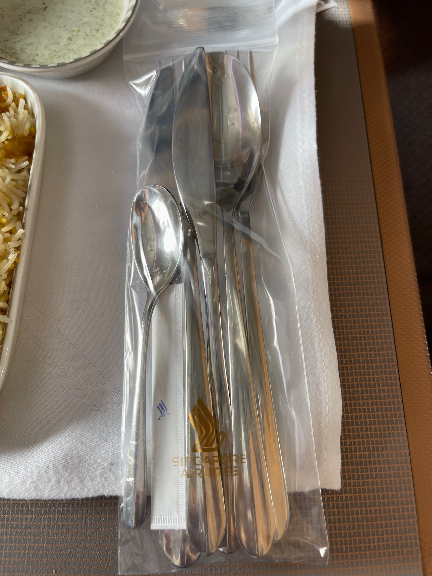 a spoons and forks in a plastic bag