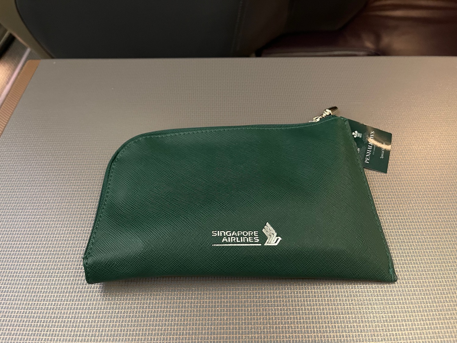 a green pouch on a table