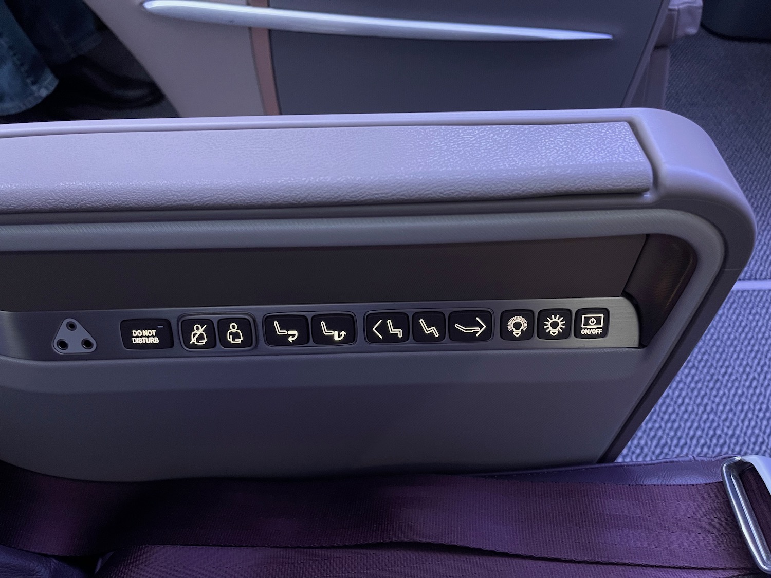 a seat with buttons and lights