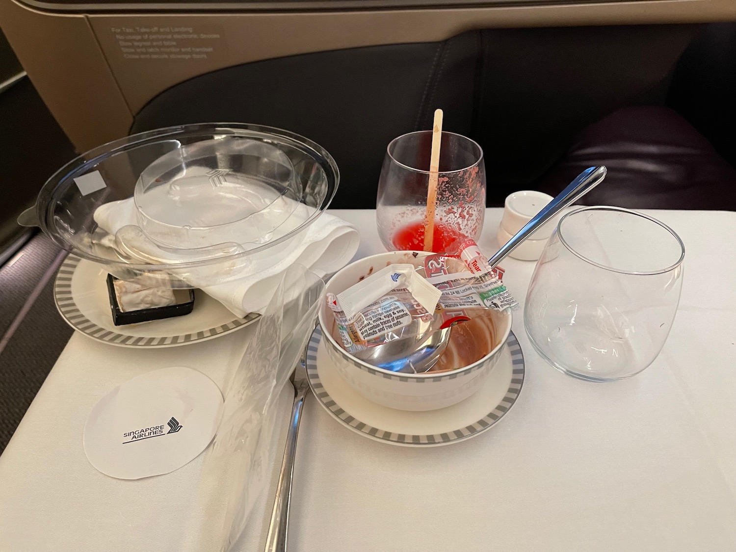 a table with plates and bowls and glasses