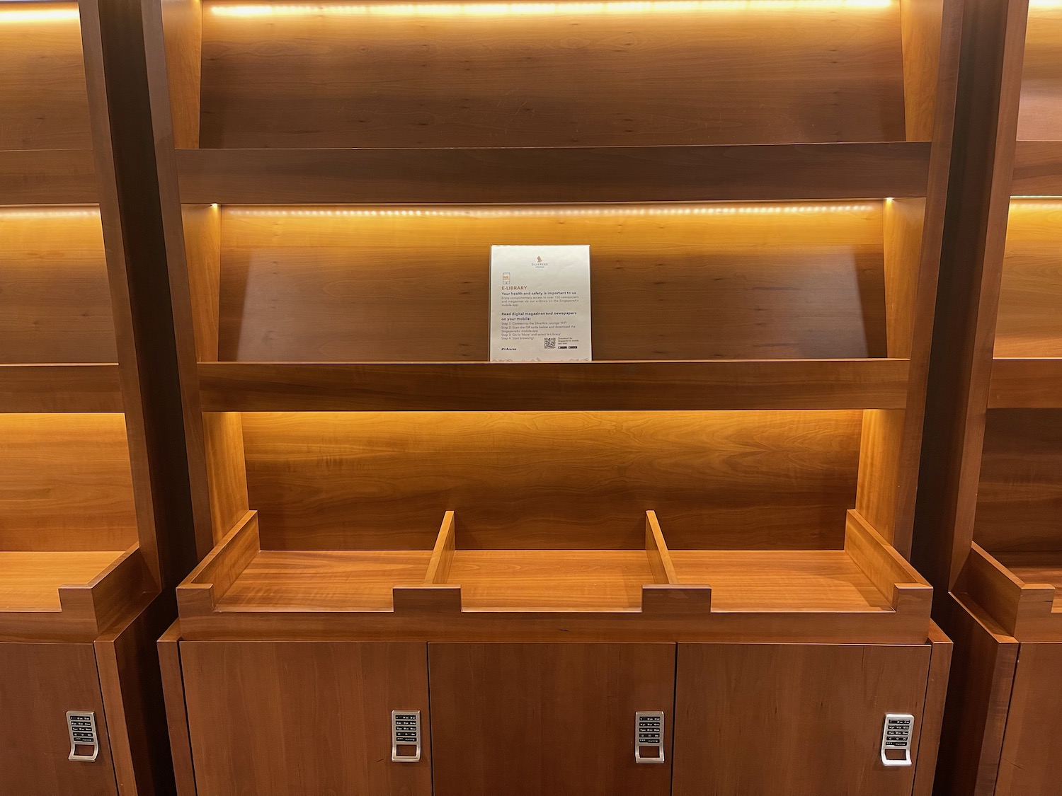 a wooden shelf with lights