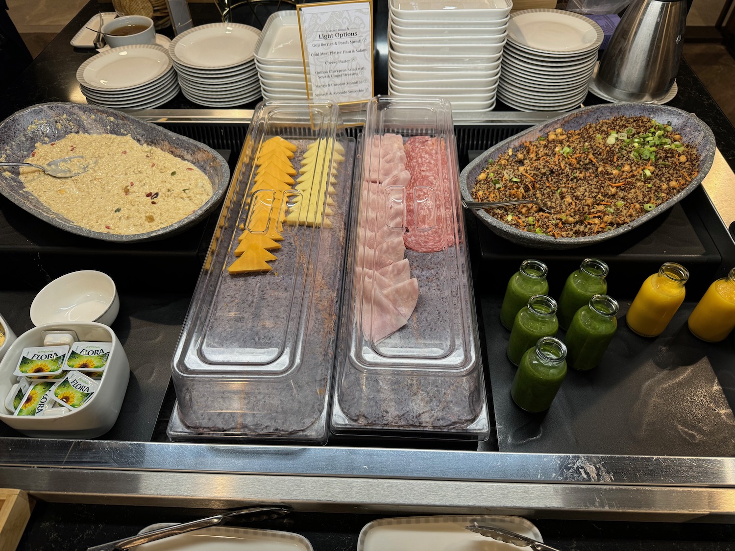 a buffet table with plates and food