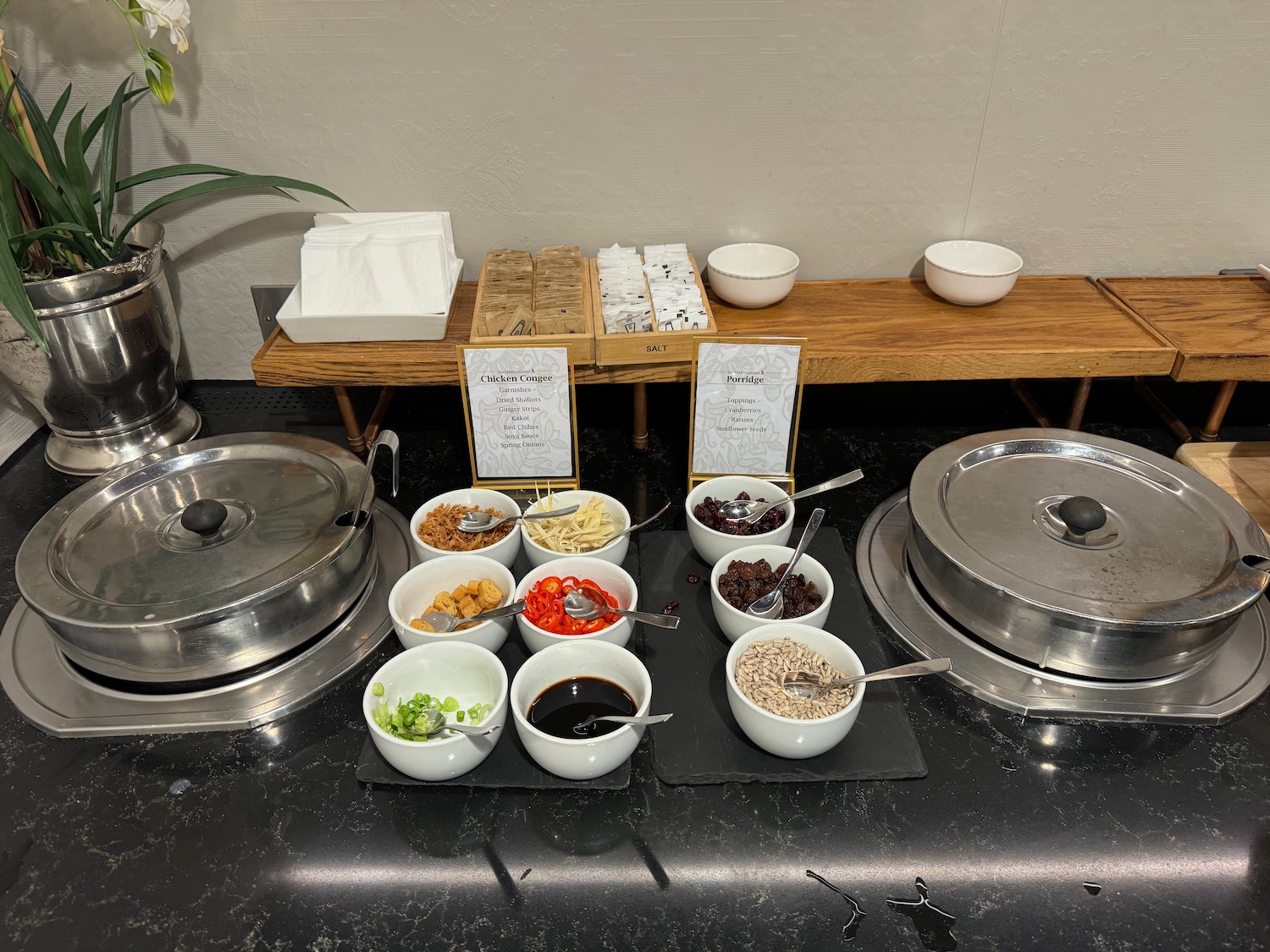 a buffet table with bowls of food