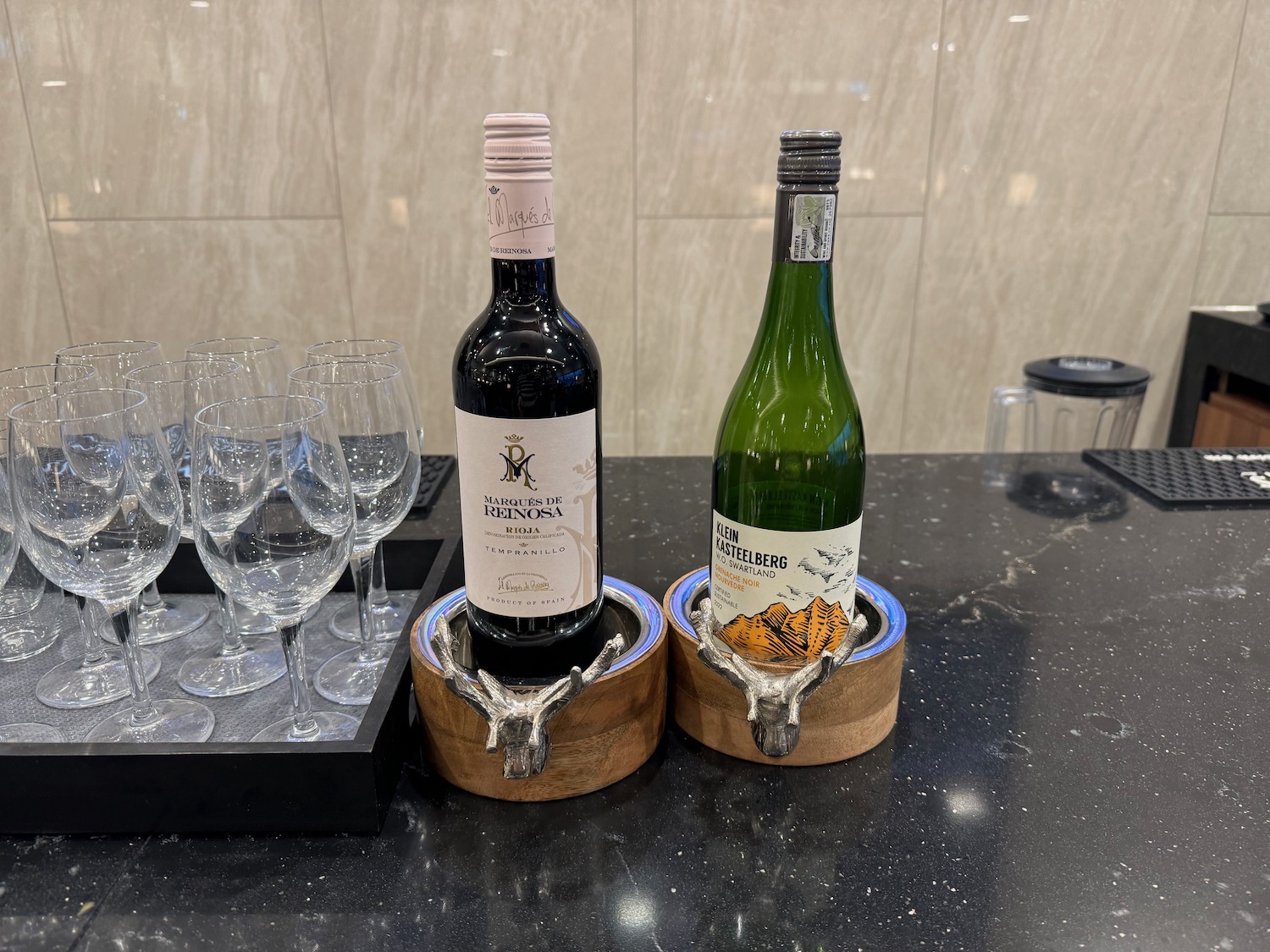 a group of wine bottles and glasses on a table