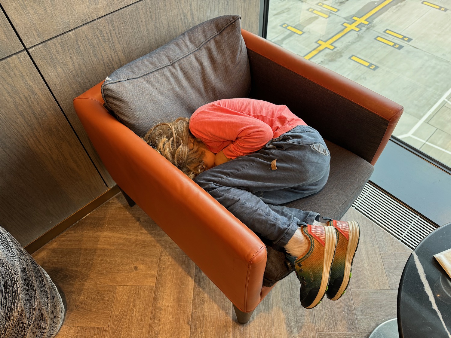 a person sleeping on a chair