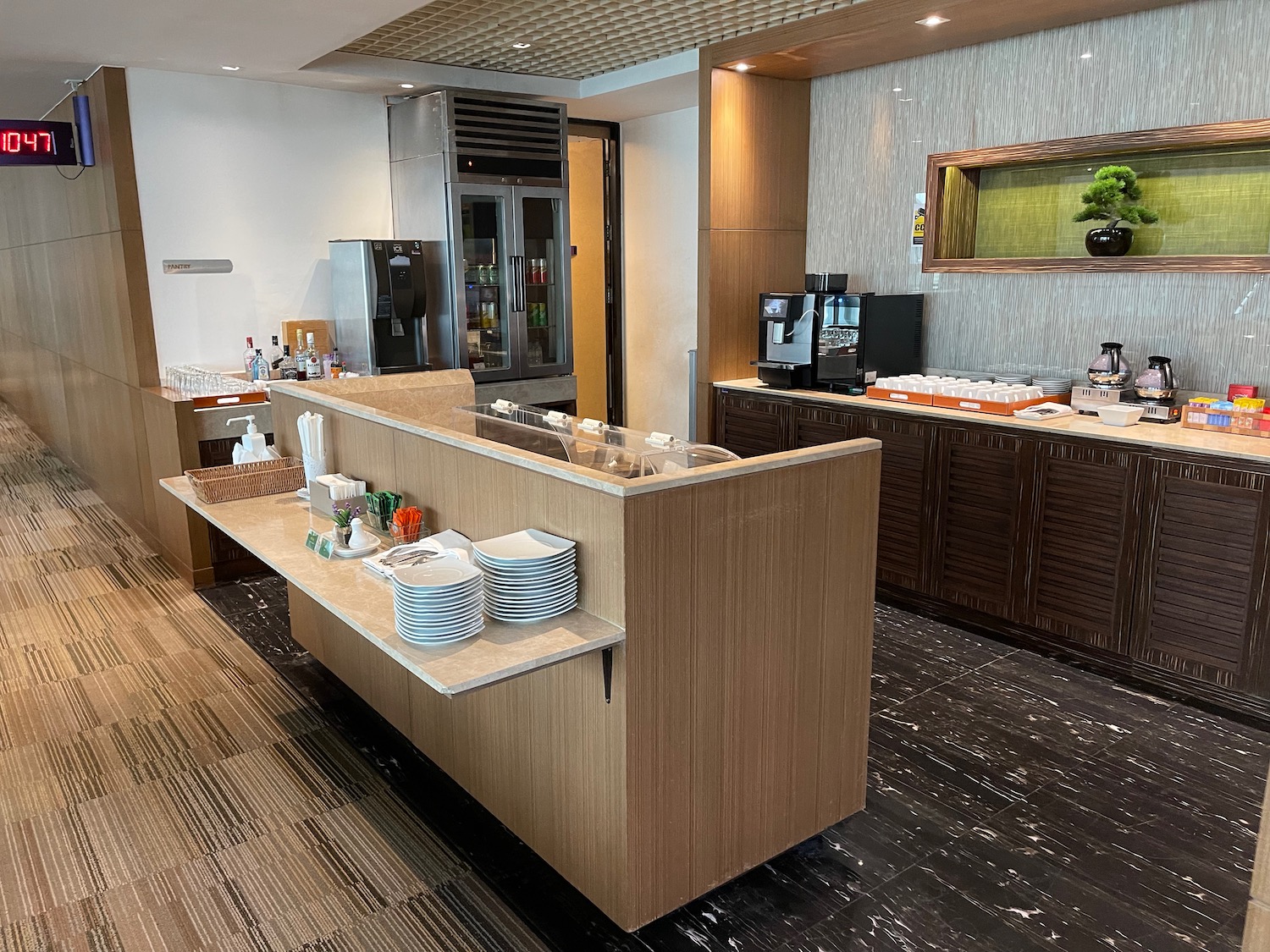 a kitchen with a counter and a refrigerator