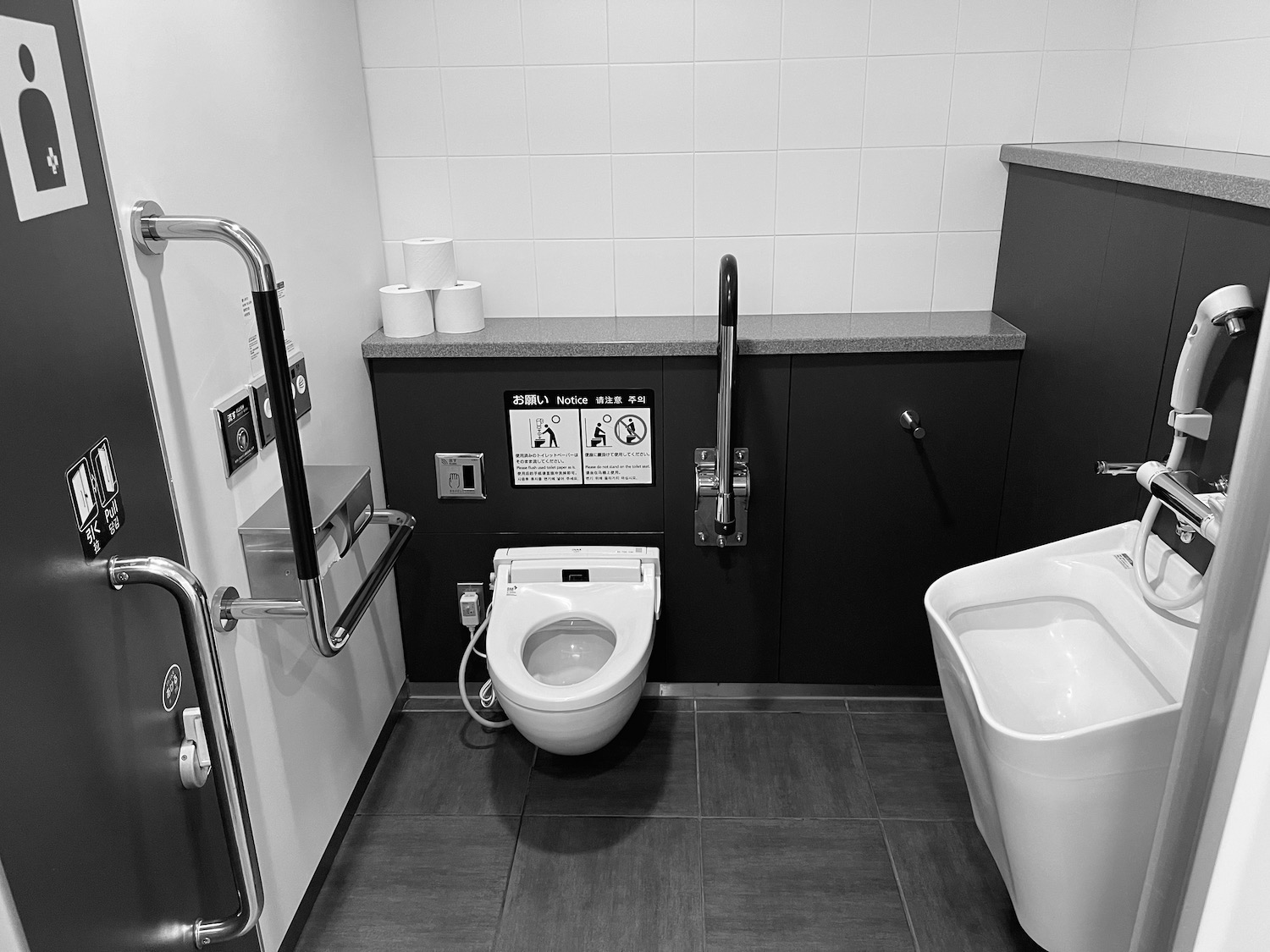 a bathroom with a toilet and a urinal