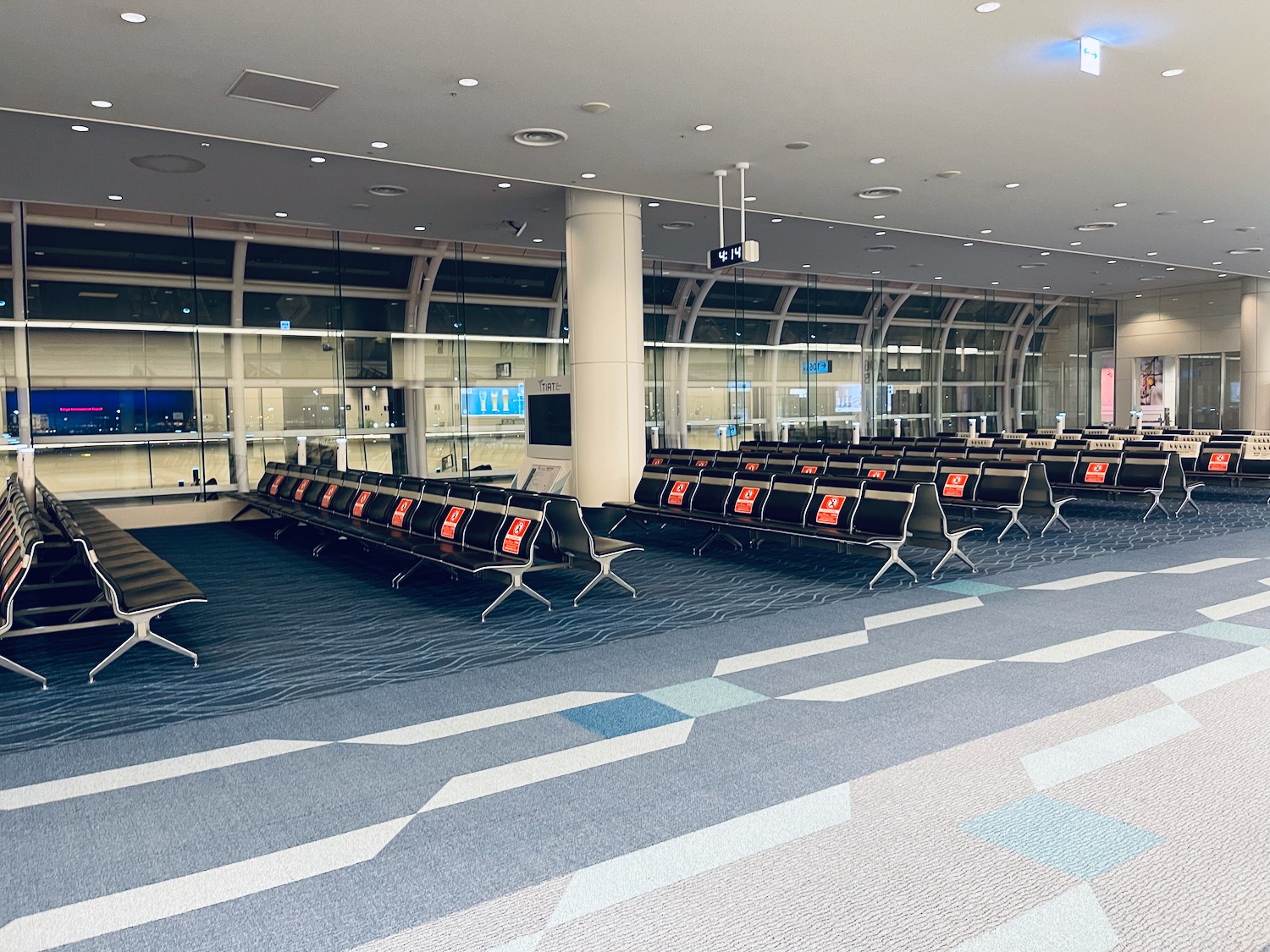 a row of chairs in an airport