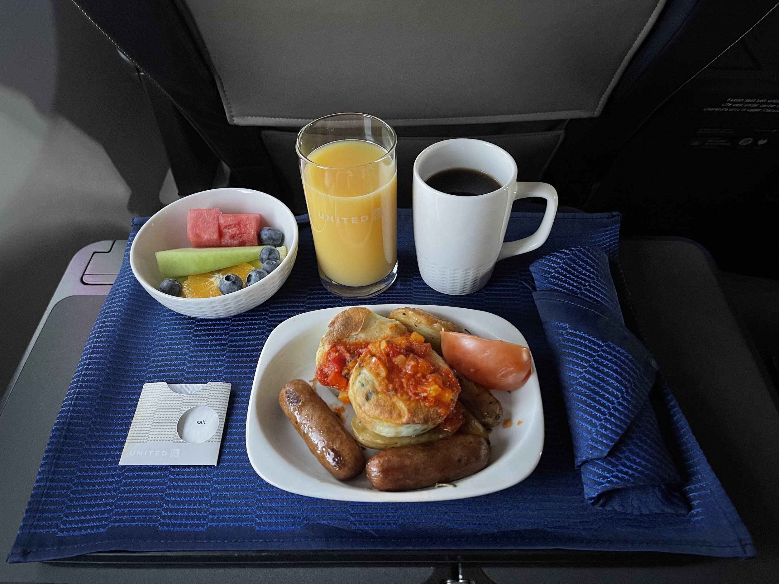 a plate of food and drinks on a tray