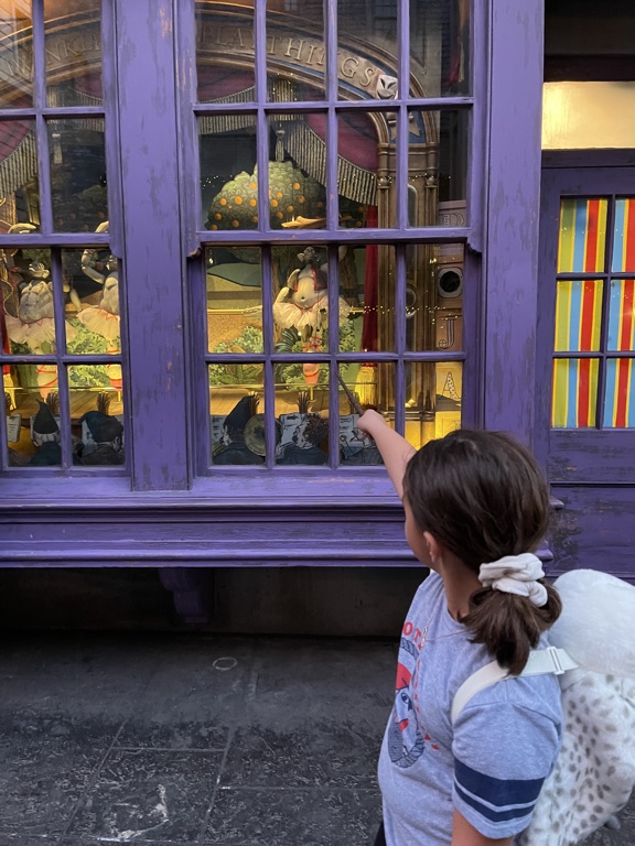 Using her wand to perform a spell at Universal Studios Orlando