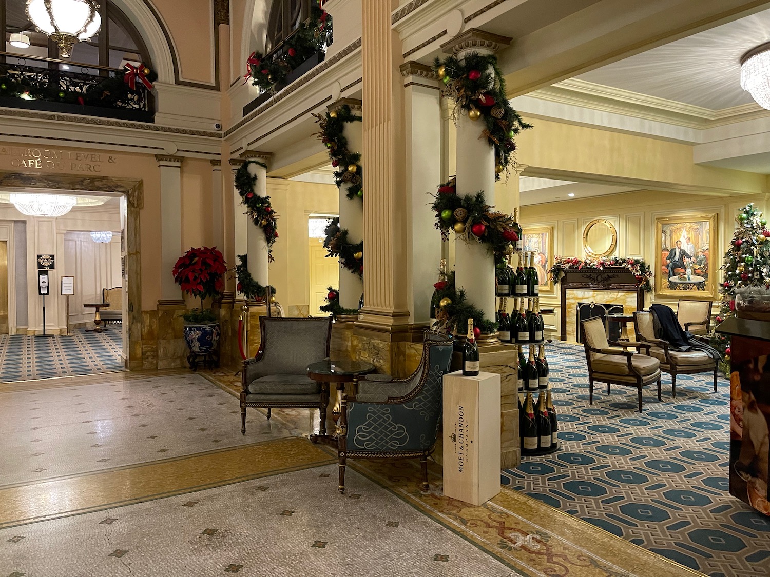a room with chairs and a table with christmas decorations