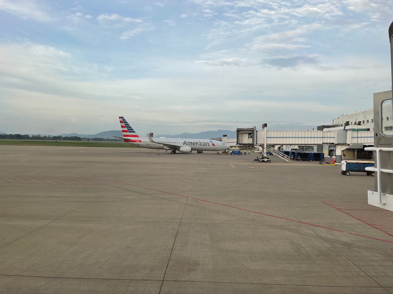 Passenger on flight arriving in Miami from Colombia opens plane door, jumps  on wing