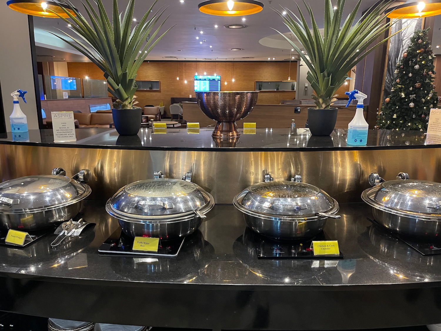 a group of silver pots on a counter