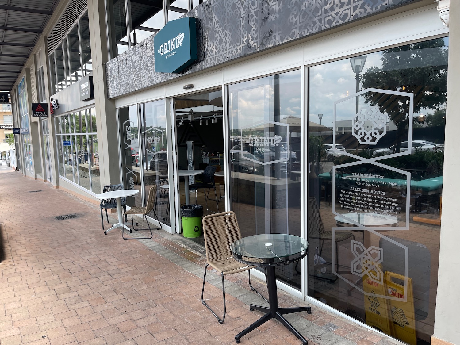 a restaurant with tables and chairs outside