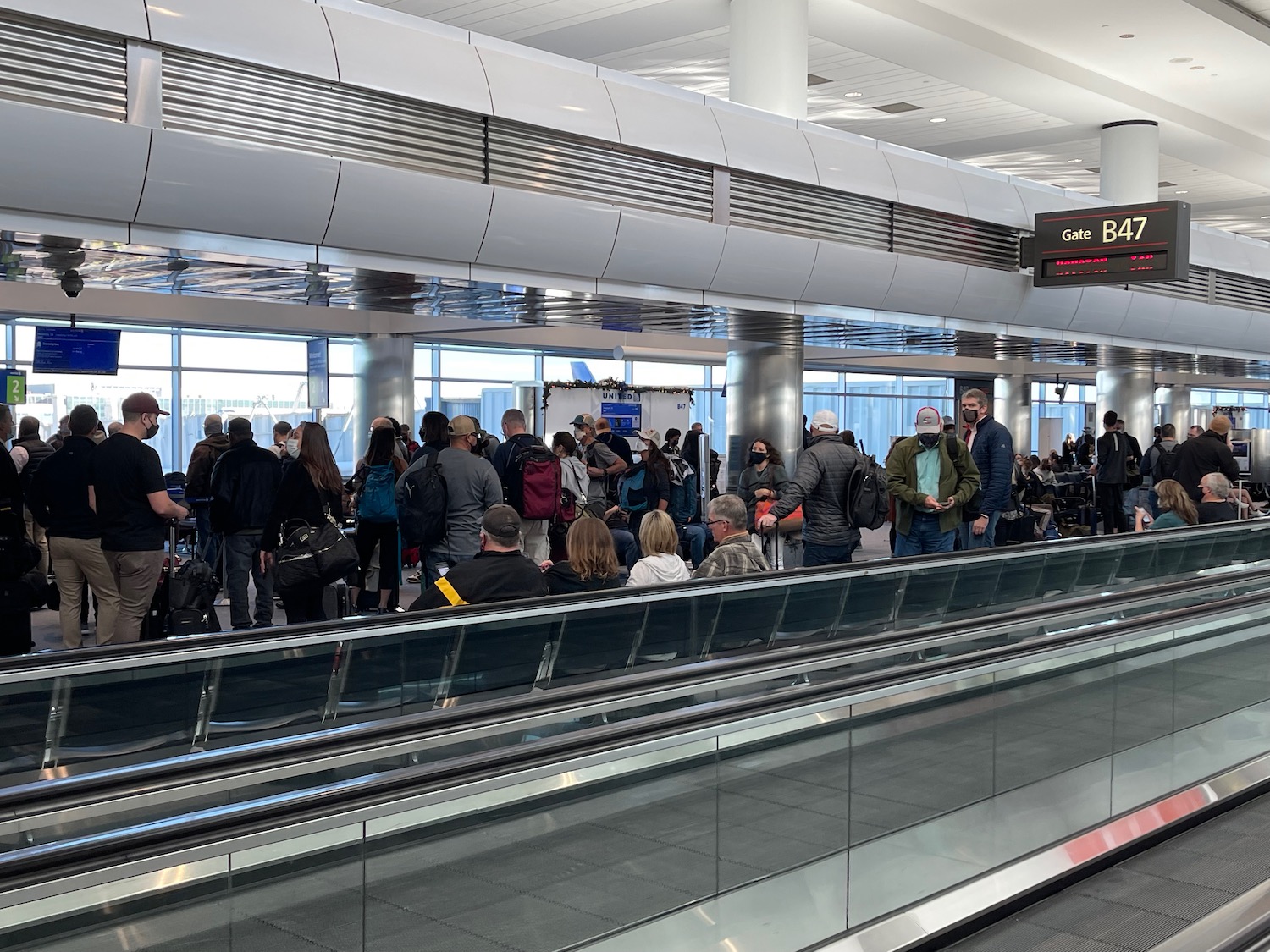 a group of people standing in a terminal