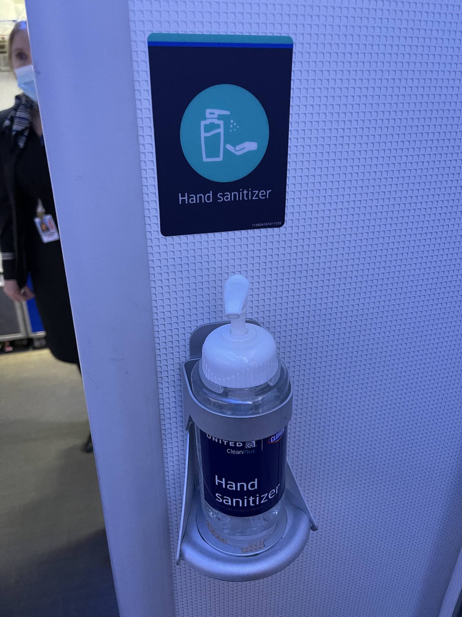 a hand sanitizer dispenser on a wall