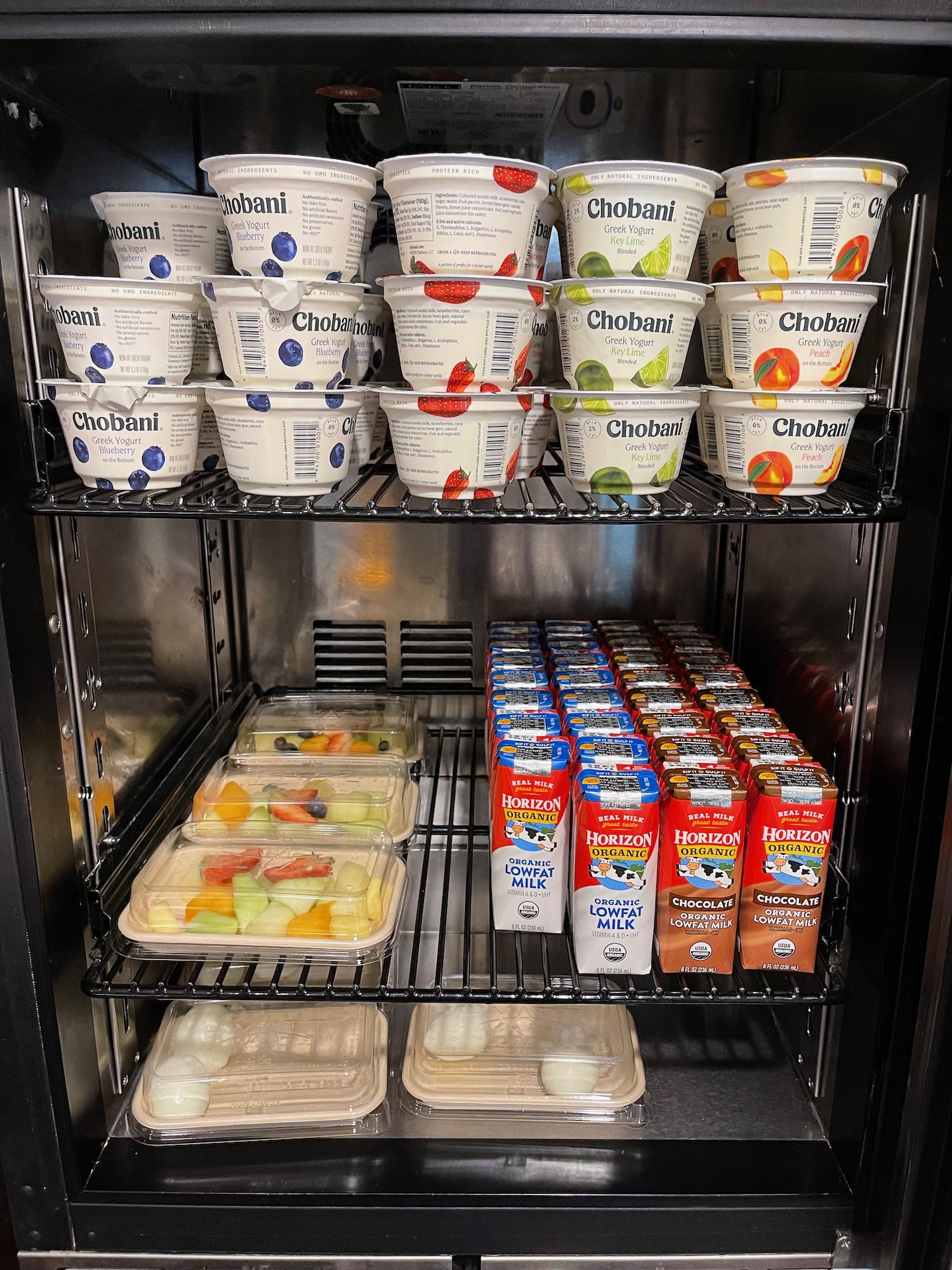 a refrigerator full of yogurt and fruit