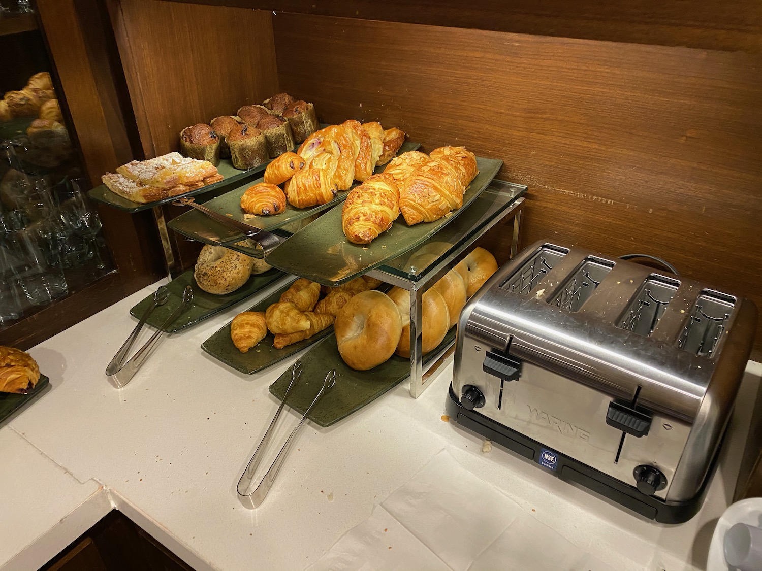 a tray of pastries and bread on a table