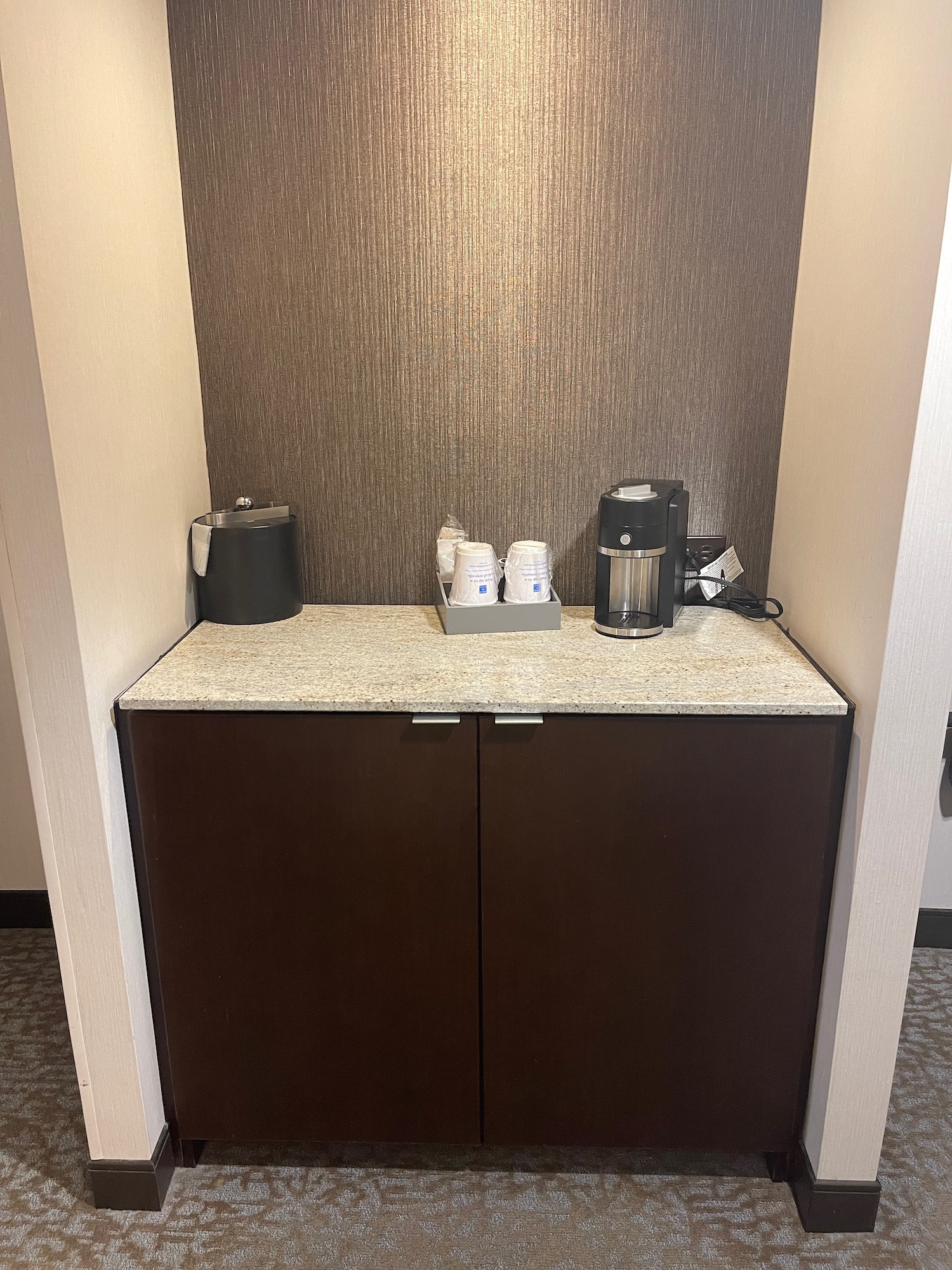 a coffee maker and coffee pot on a counter