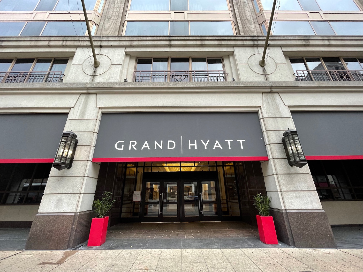 a building with glass doors and a sign