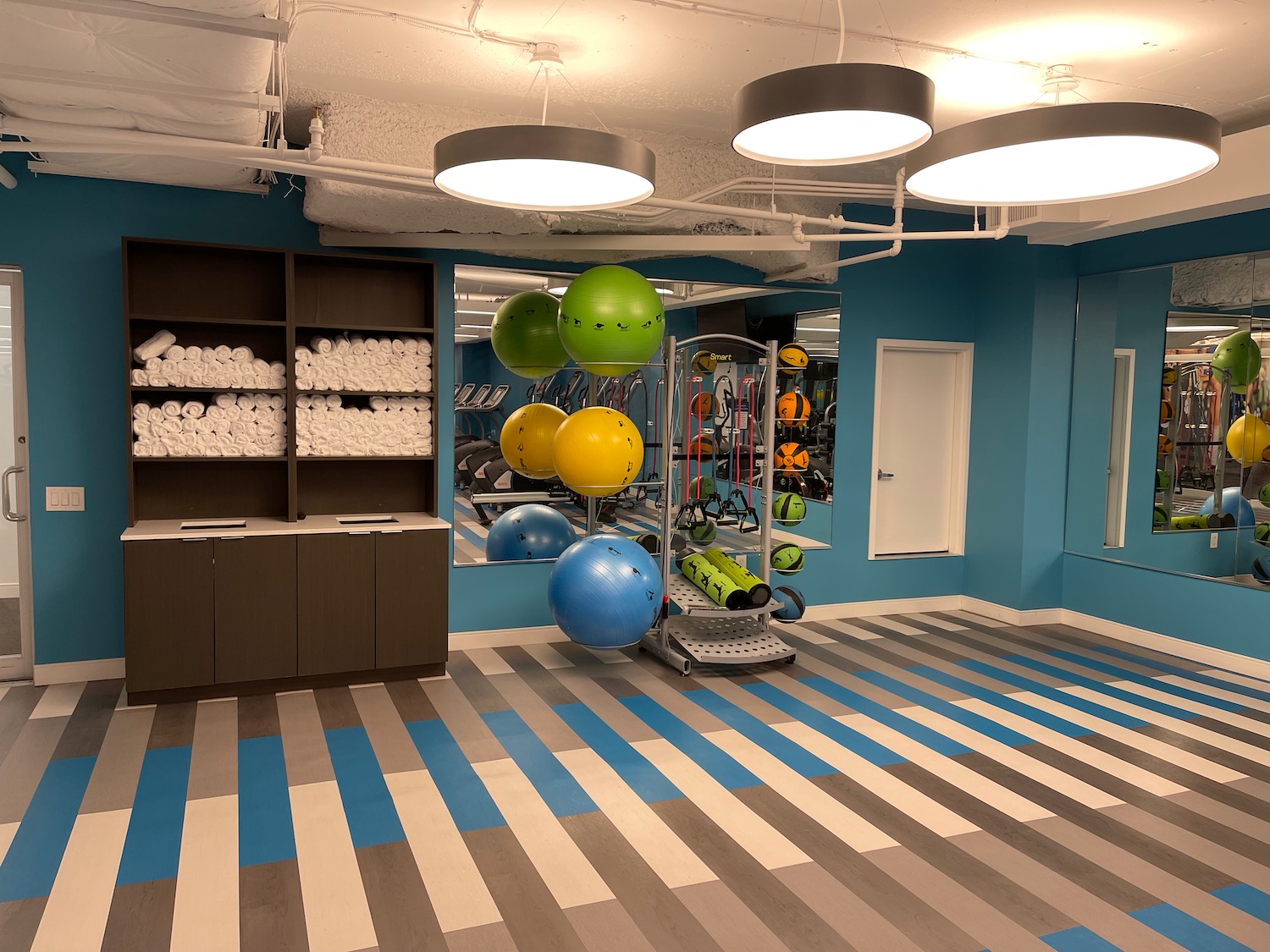 a gym with balls and exercise equipment