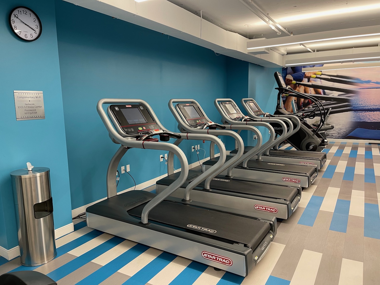 a group of treadmills in a gym