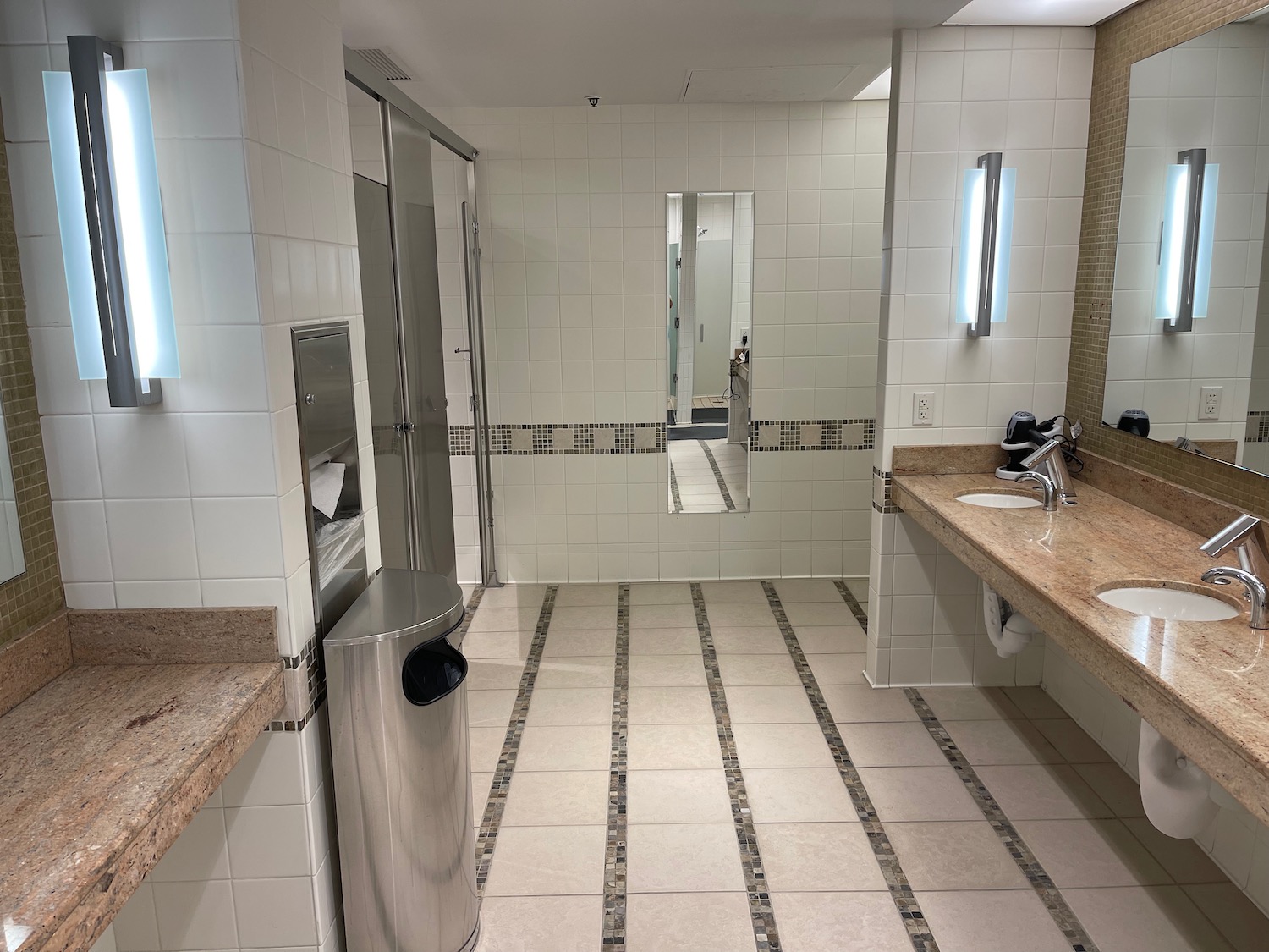 a bathroom with a mirror and sink