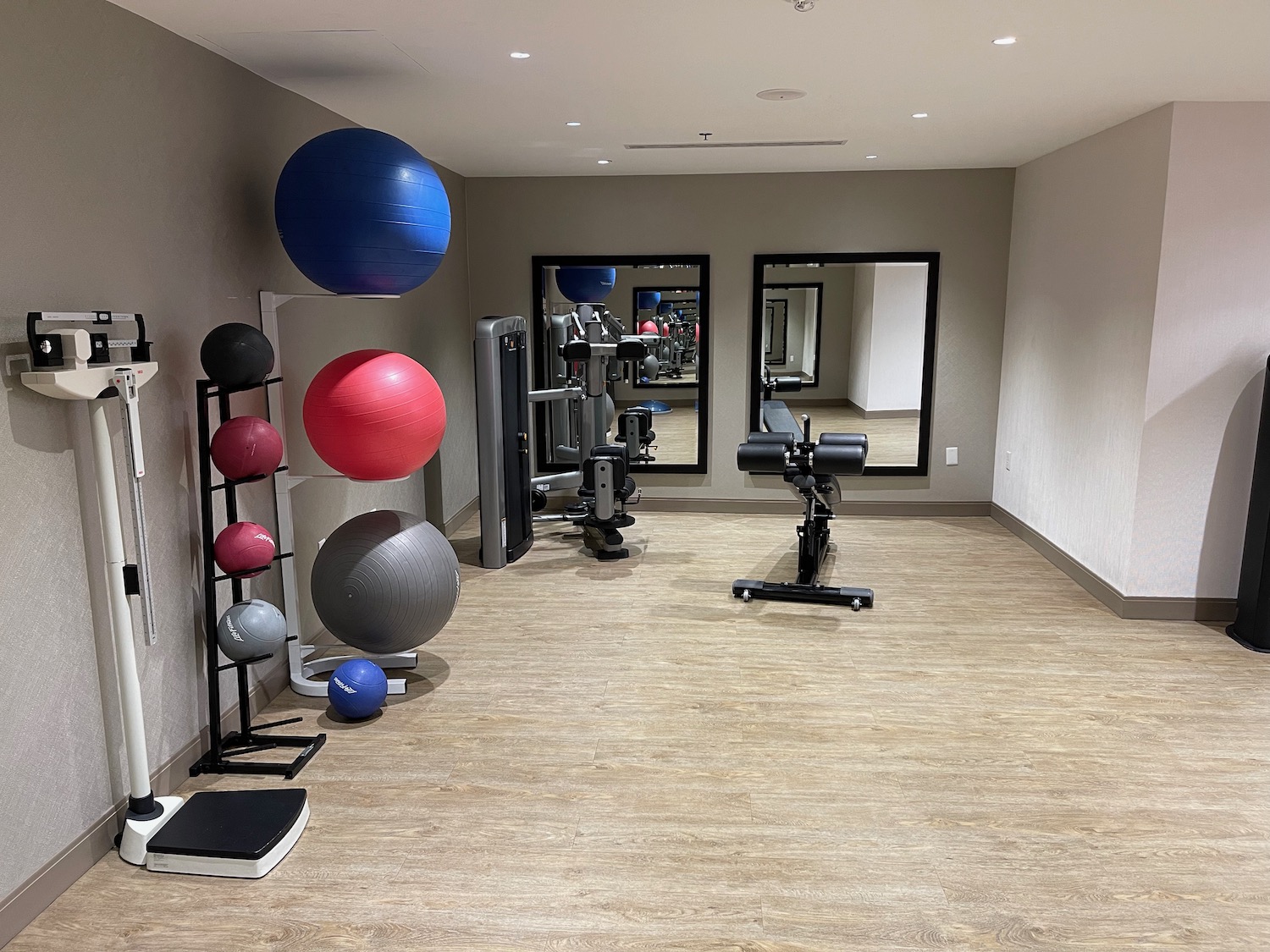 a room with exercise equipment and exercise equipment