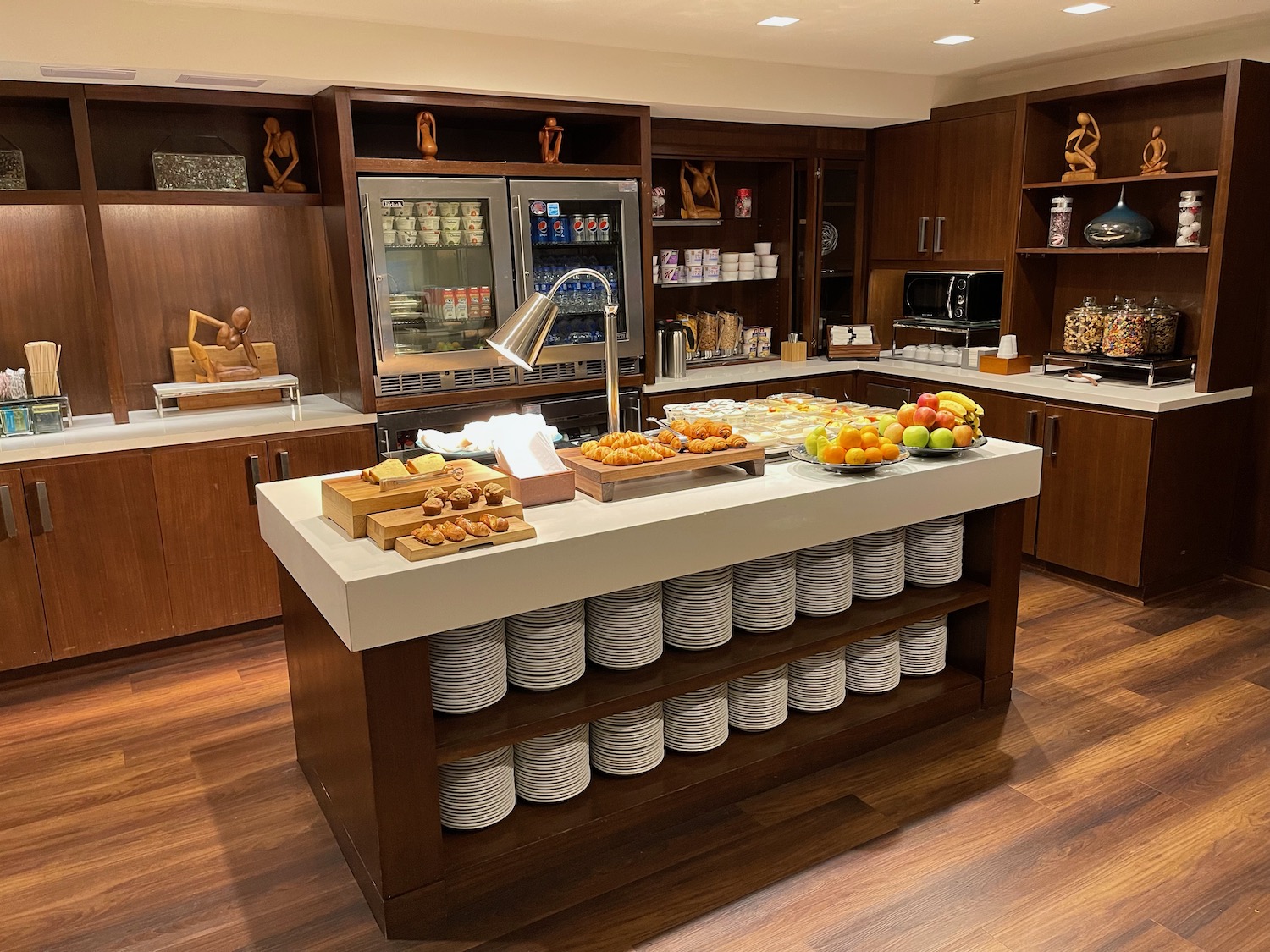 a kitchen with a buffet and food on it