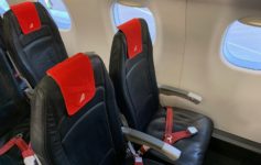 seats in a plane with red seats