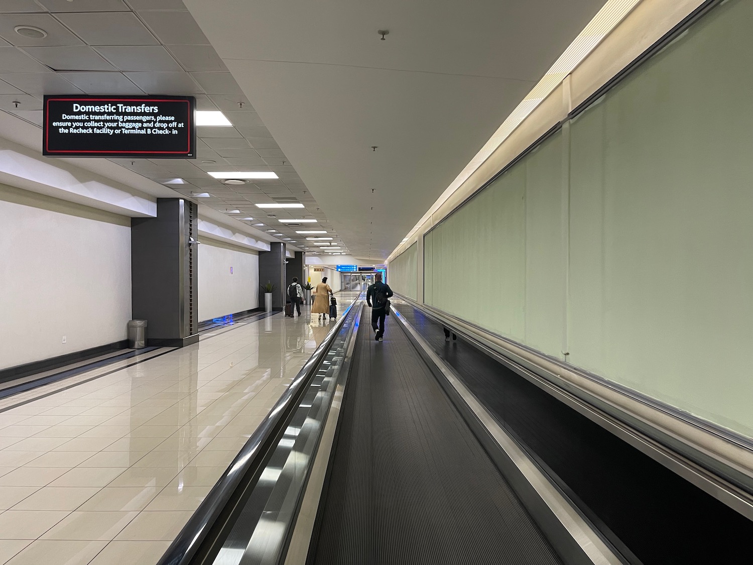 a person walking on a moving conveyor