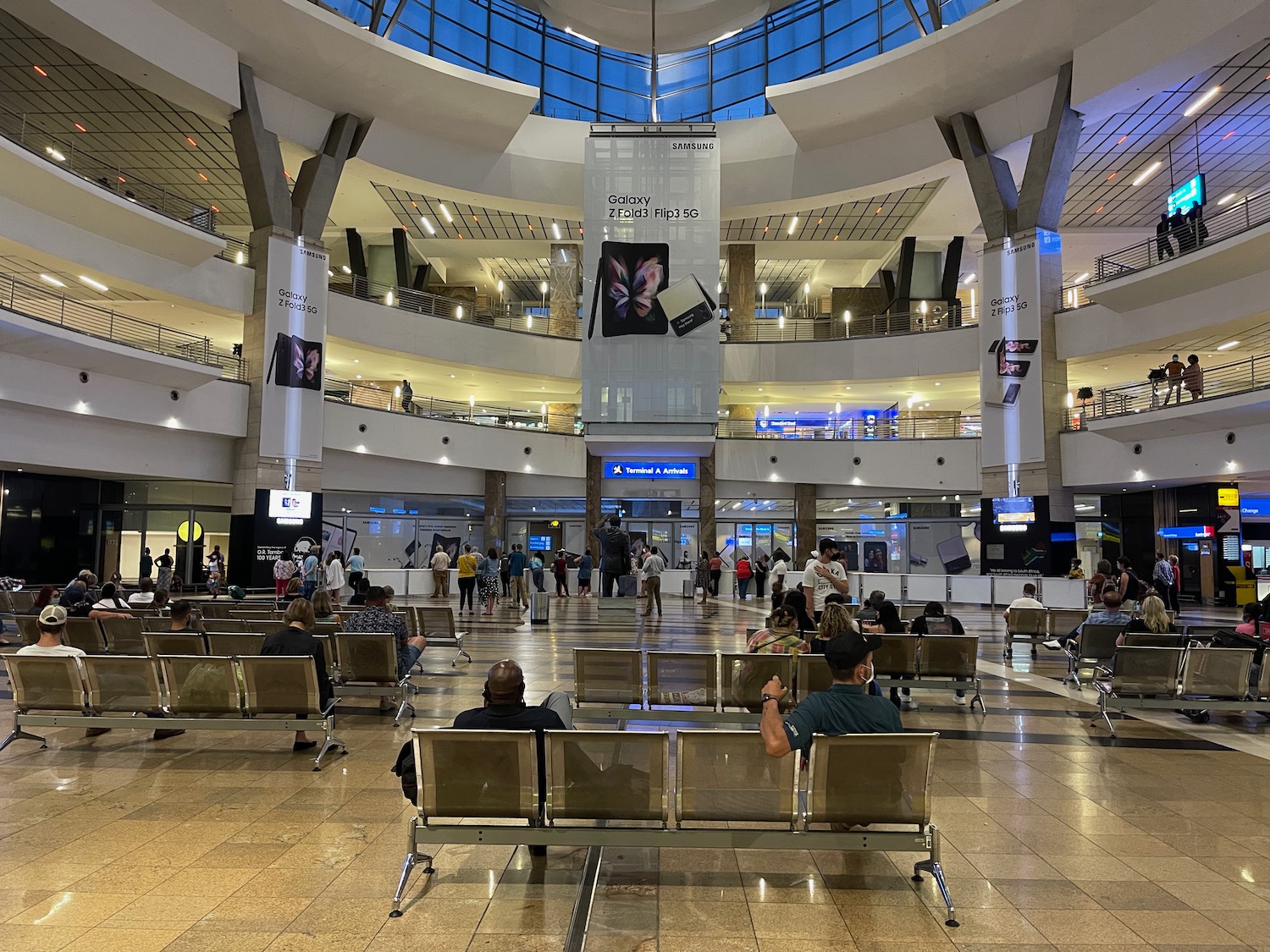 a large building with many people sitting in chairs