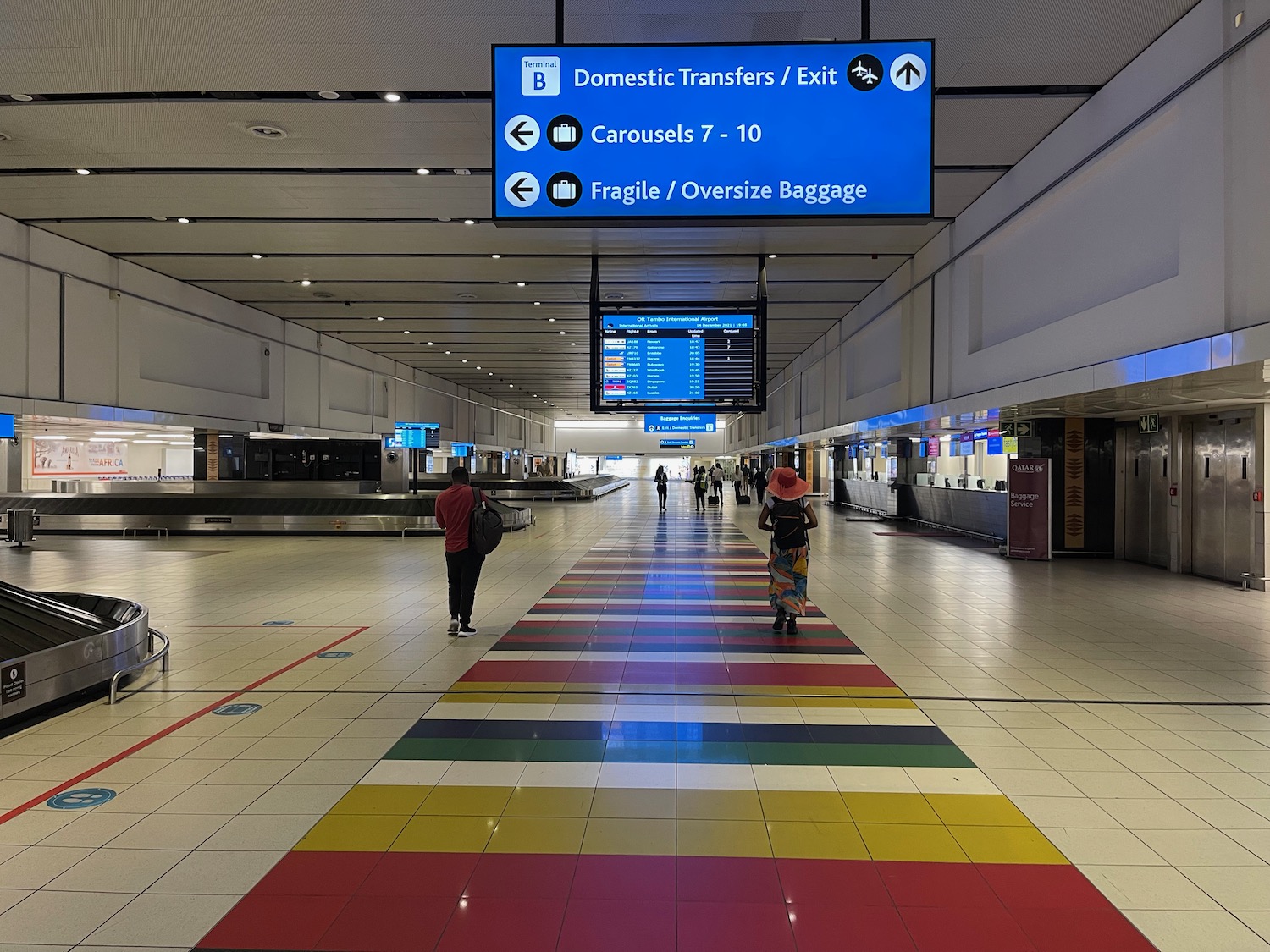 people walking in a large airport