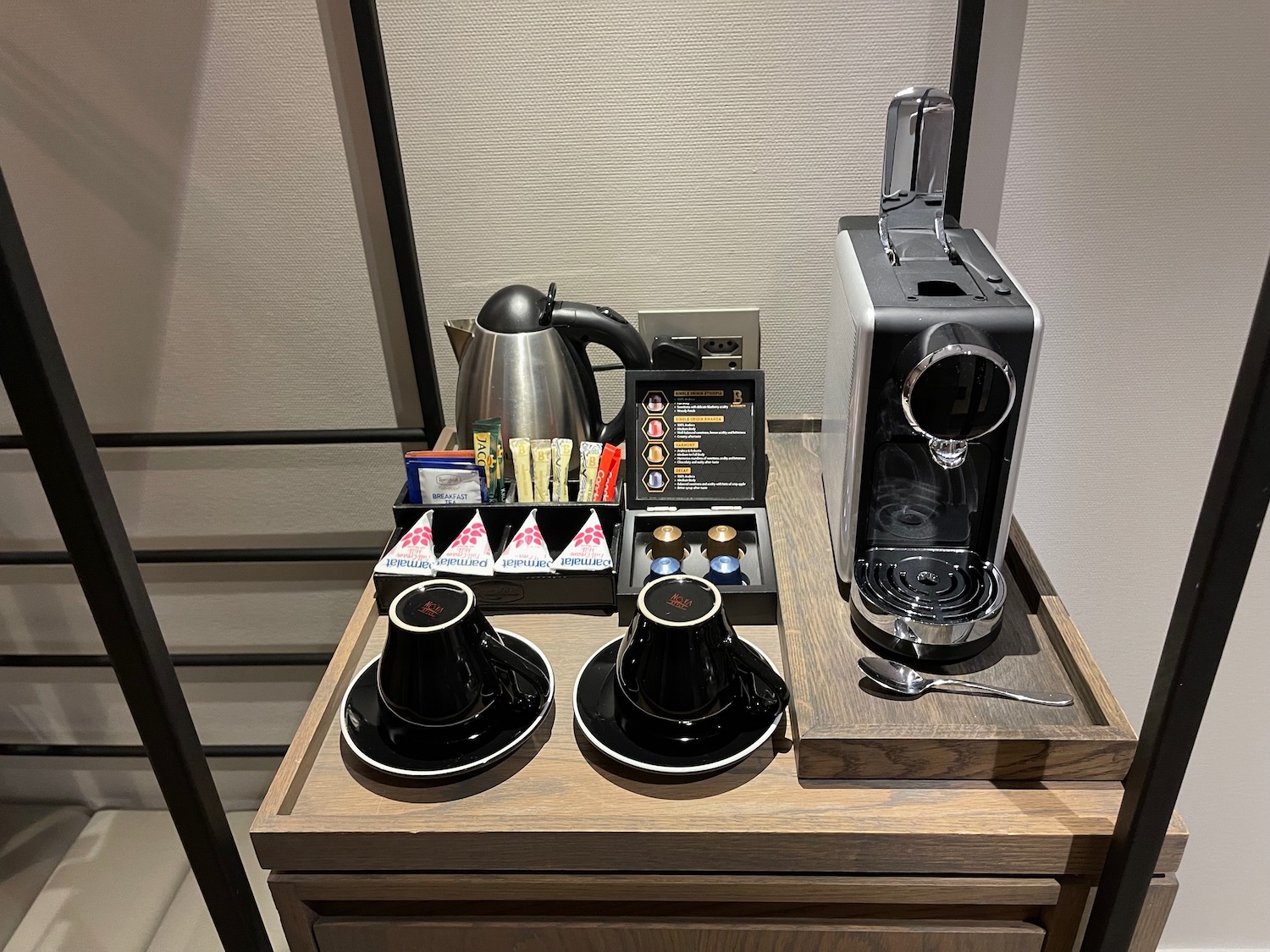 a coffee machine and cups on a table