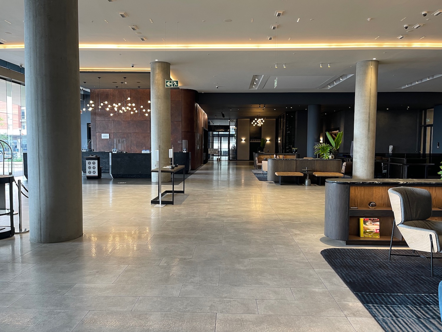 a large lobby with columns and tables