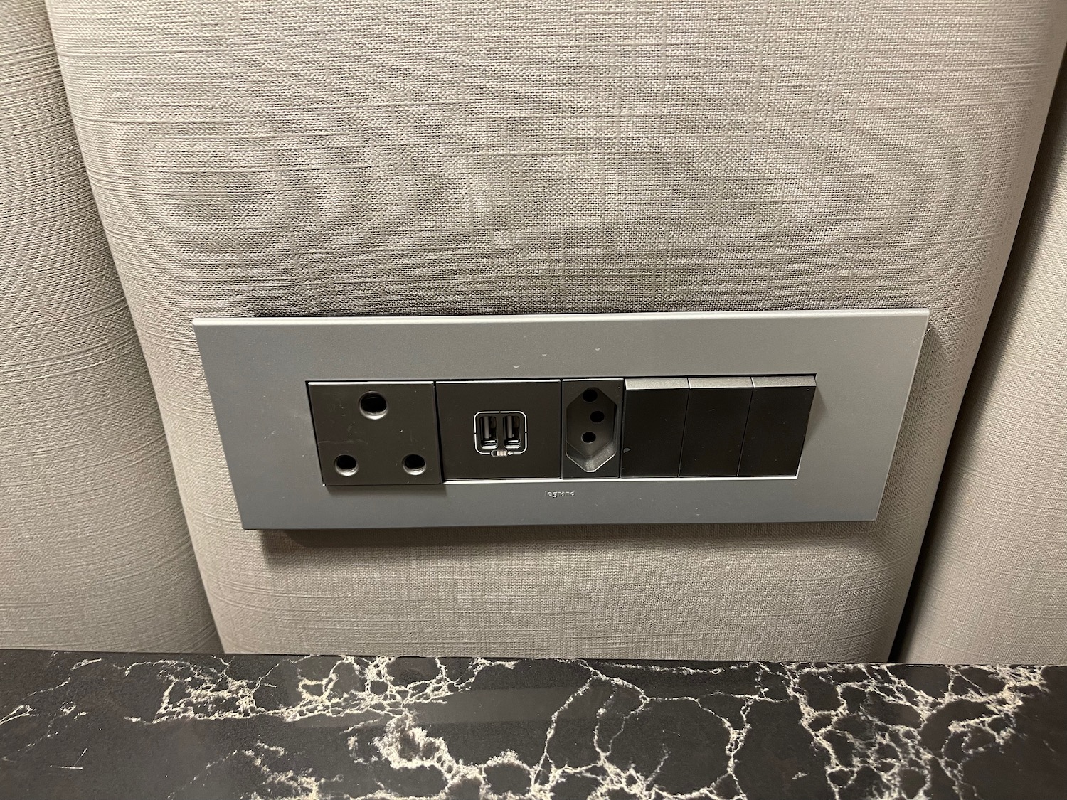 a wall outlet with a black and white surface