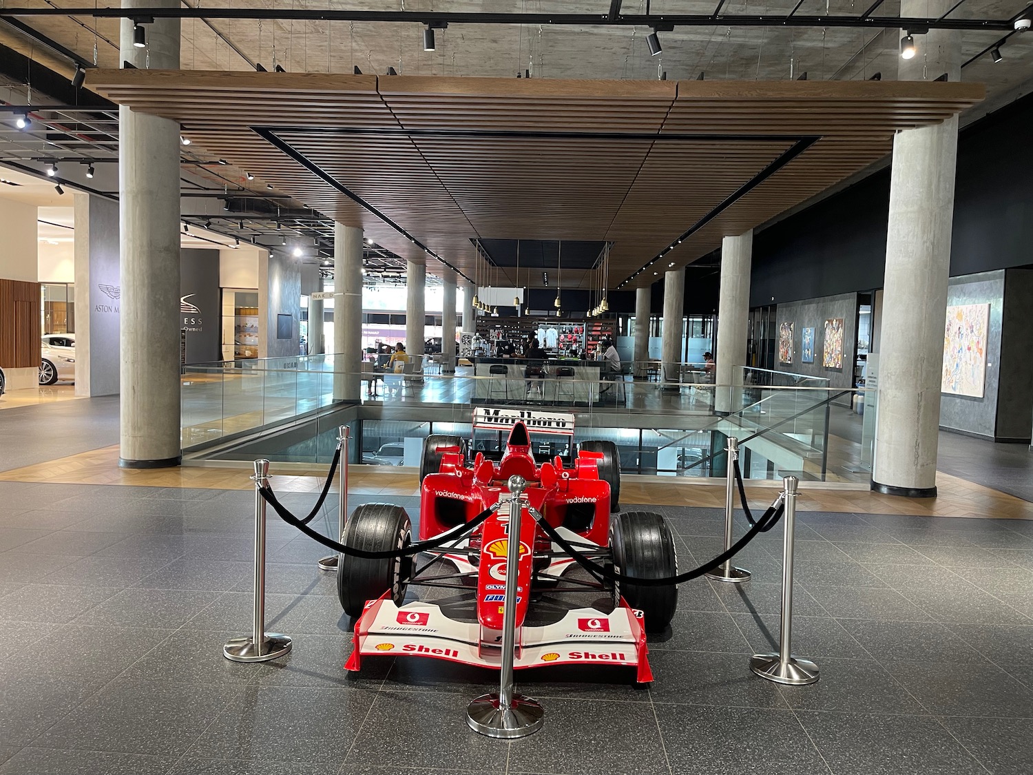a red race car in a museum
